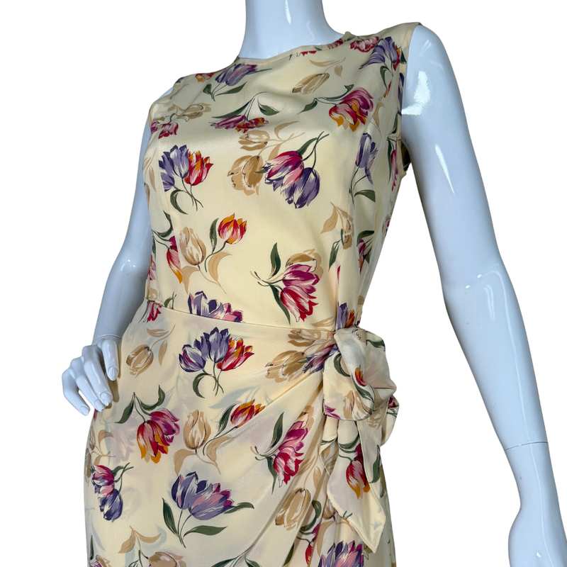 Load image into Gallery viewer, August Silk Floor-length Vibrant Floral Dress is a sleeveless, floor-length piece with a soft cream base adorned with a vibrant floral print
