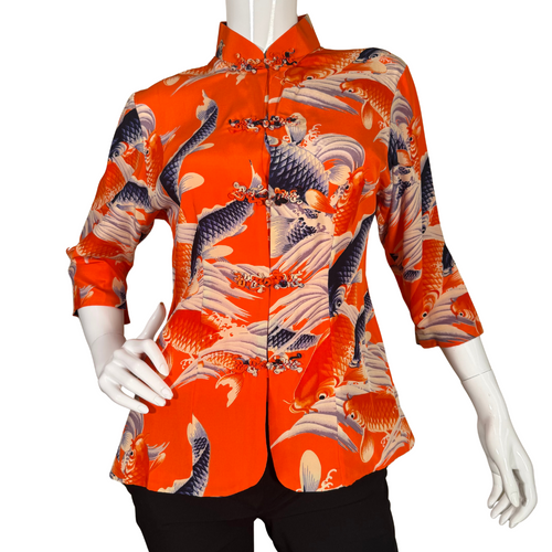 Vibrant and bold, this donated Avanti Bright Orange Silk Shirt with Koi Fish showcases a lively design of koi fish swimming among stylized waves in shades of navy, cream, and orange on a rich red background