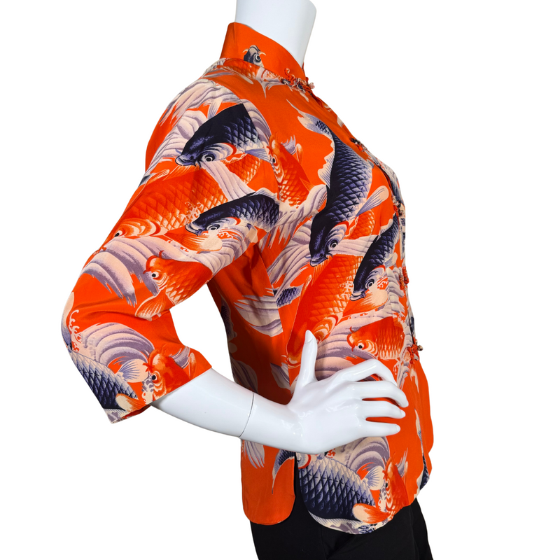 Load image into Gallery viewer, Vibrant and bold, this donated Avanti Bright Orange Silk Shirt with Koi Fish showcases a lively design of koi fish swimming among stylized waves in shades of navy, cream, and orange on a rich red background
