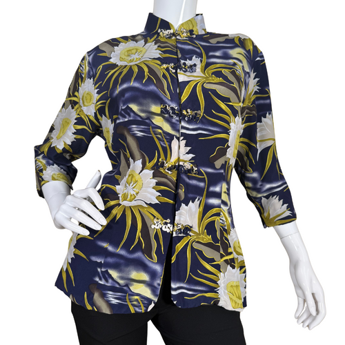 pre-loved Avanti Navy Blue Silk Floral Mandarin Blouse features a striking floral print with large, white and yellow flowers set against a navy blue background with wavy accents, evoking the feel of a moonlit garden.
