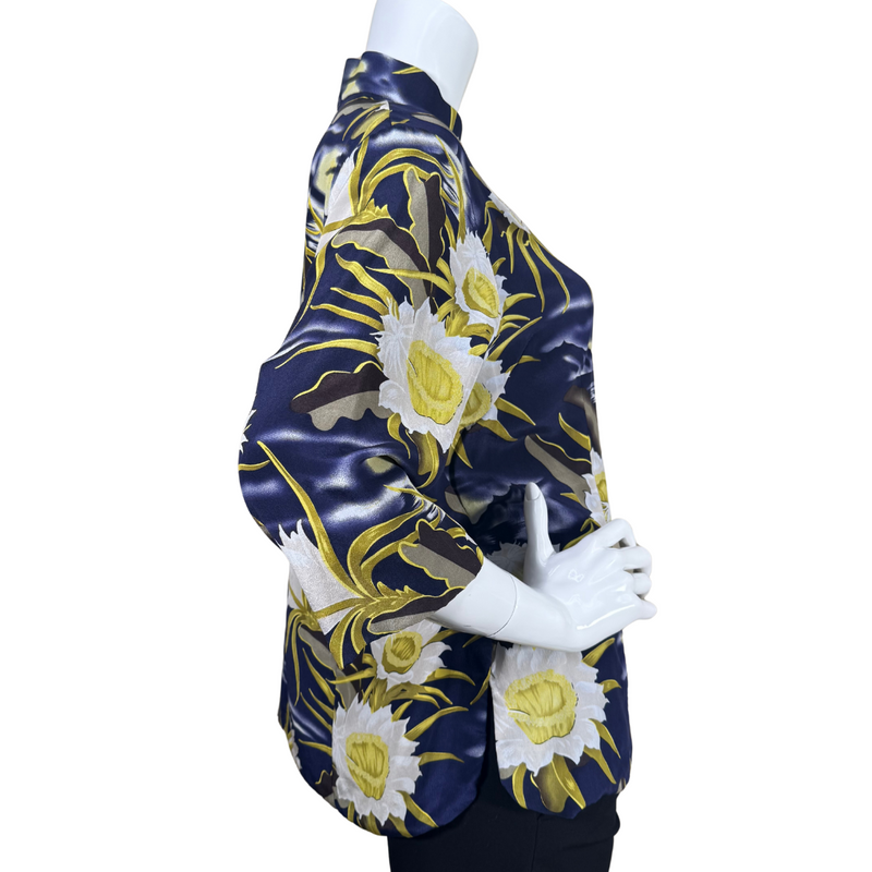 Load image into Gallery viewer, pre-loved Avanti Navy Blue Silk Floral Mandarin Blouse features a striking floral print with large, white and yellow flowers set against a navy blue background with wavy accents, evoking the feel of a moonlit garden.
