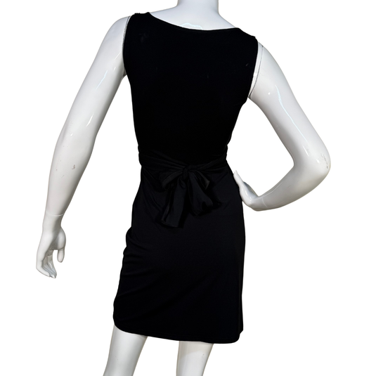 Black dress on a mannequin against a white background