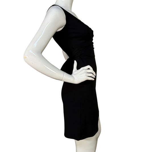 Black dress on a white mannequin against a white background