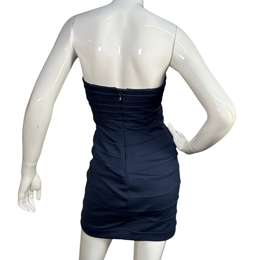 Navy blue dress on a mannequin against a white background