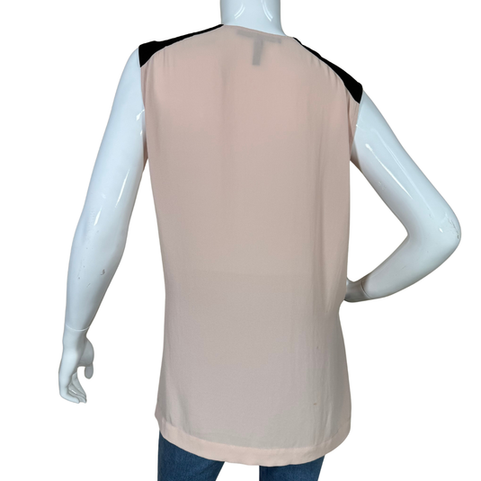 Beige sleeveless top with black accents on a mannequin against a white background