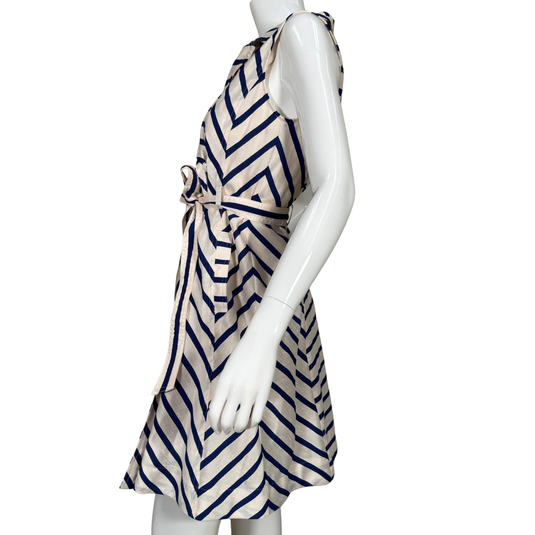 Mannequin wearing a dress with blue and beige geometric pattern on a white background
