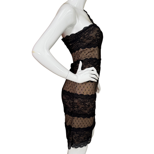 Black lace dress on a white mannequin against a white background