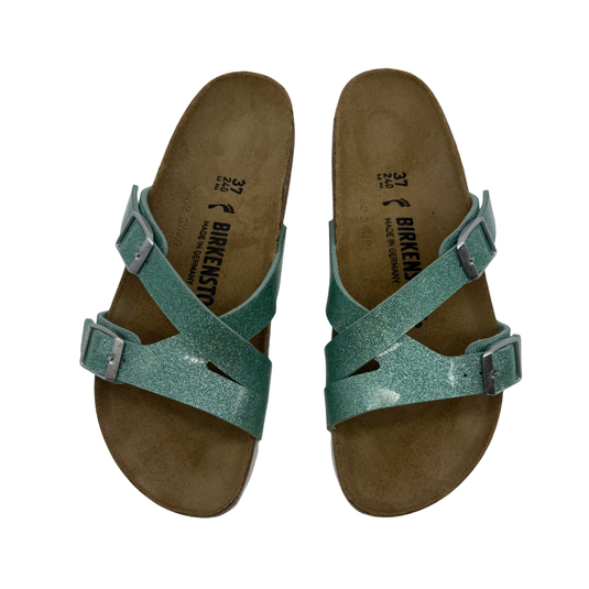 Birkenstock Glitter Green Sandals, featuring glittery green criss-cross straps with adjustable buckles for a perfect fit