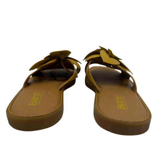 Børn Yellow Leather Flower Slide Sandals. Handcrafted with a bold, oversized leather flower accent and cushioned footbed
