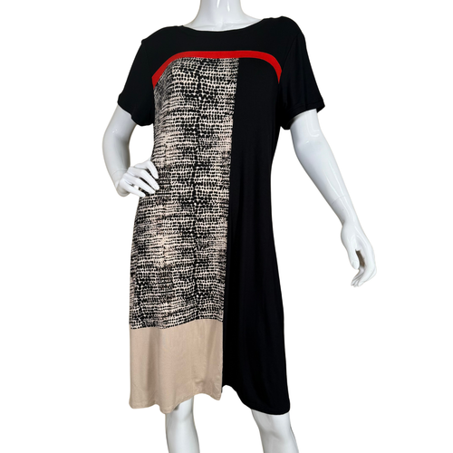 Mannequin wearing a black dress with patterned beige section on a white background