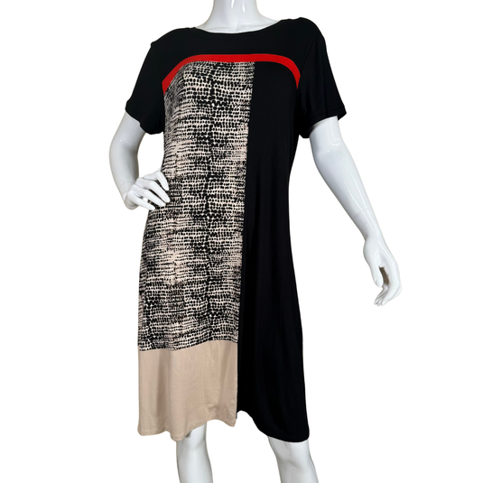 Mannequin wearing a black dress with patterned beige section on a white background