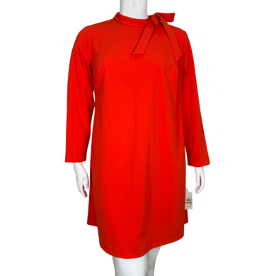 Red dress with a bow detail on a mannequin against a white background