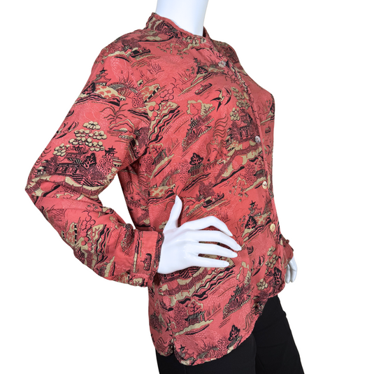 pre-loved soft, Citron Vintage Terra Cotta Colored Scenic Landscape Blouse features an intricate landscape print depicting traditional Asian architecture, serene waters, trees, and birds in flight