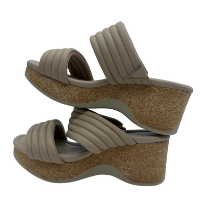 Clarks Neutral Quilted Platform Slide Sandals. Featuring a plush padded double strap and a cork-inspired wedge sole
