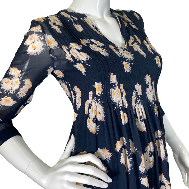 Load image into Gallery viewer, Club Monaco Floral Sheer Silk Blouse is stylish navy blue floral tunic blouse with a flowy, relaxed fit, perfect for casual wear or dressing up - side view close up
