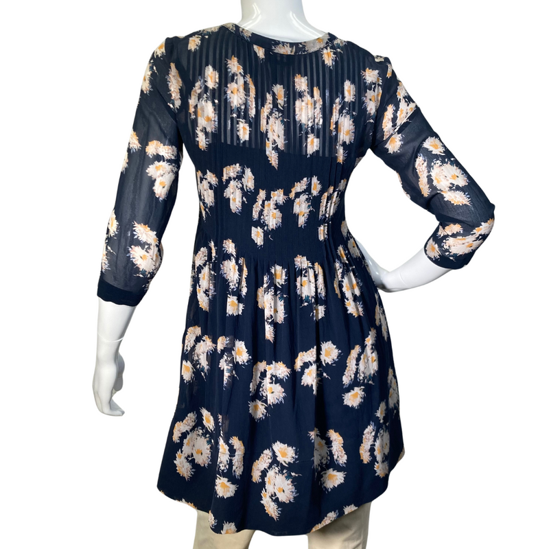 Load image into Gallery viewer, Club Monaco Floral Sheer Silk Blouse is stylish navy blue floral tunic blouse with a flowy, relaxed fit, perfect for casual wear or dressing up - back side view 
