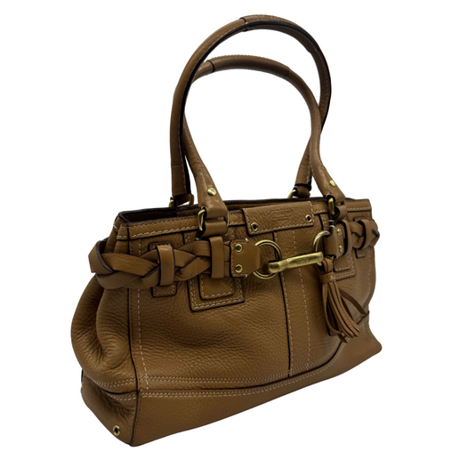 Coach Beige Leather Shoulder Bag is crafted from high-quality caramel brown pebbled leather, featuring beautiful braided detailing on the sides and signature gold-tone horsebit hardware on the front for a sophisticated equestrian-inspired touch.