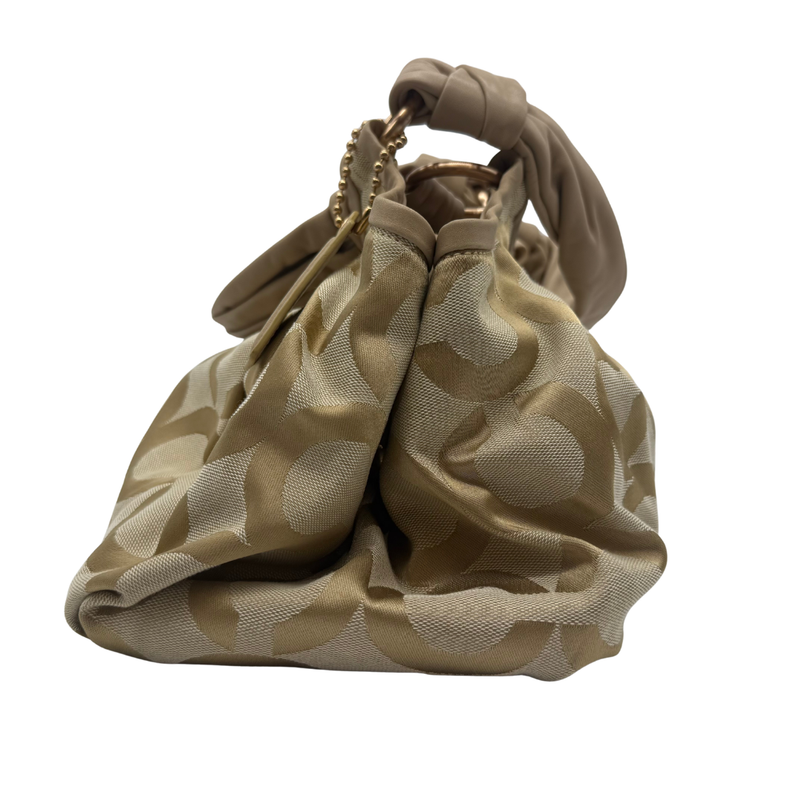 Load image into Gallery viewer, Beige patterned handbag on a white background
