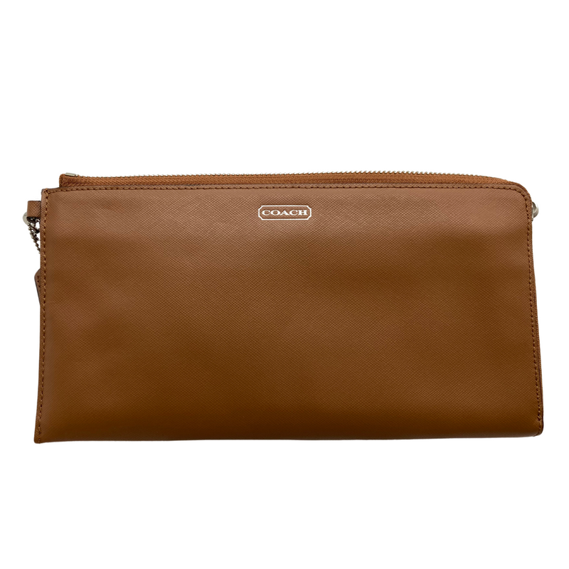 Load image into Gallery viewer, This pre-loved Coach Brown Wristlet with Silver Zipper, crafted from smooth leather with a subtle textured finish. It features a zippered closure, a detachable wrist strap for versatile use, and the iconic Coach logo displayed on the front.&nbsp;
