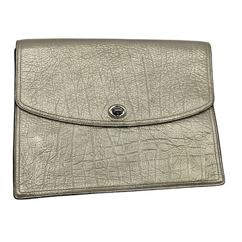 This pre-loved Coach Champagne Gold Clutch item is a metallic silver clutch bag with a textured finish resembling crinkled leather. It features a flap closure secured by a twist-lock mechanism, giving it a sleek and elegant look.