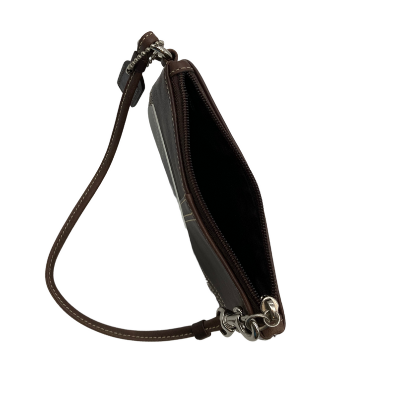 Load image into Gallery viewer, This pre-loved Coach Mini Brown Wristlet Pouch item is a compact wristlet pouch in a rich brown tone with contrast white stitching. It features a zippered closure and a detachable wrist strap for convenient carrying.
