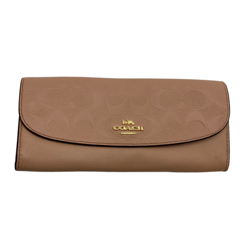 pre-loved Coach Small Monogram Brown Purse is a stylish Coach wristlet crafted from brown canvas featuring the brand's iconic 