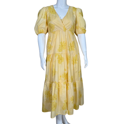 cheerful Coach Summer Yellow Floral Maxi Dress with Liner. Crafted from lightweight fabric, it showcases an allover soft floral print and a tiered skirt for a breezy, feminine flow.