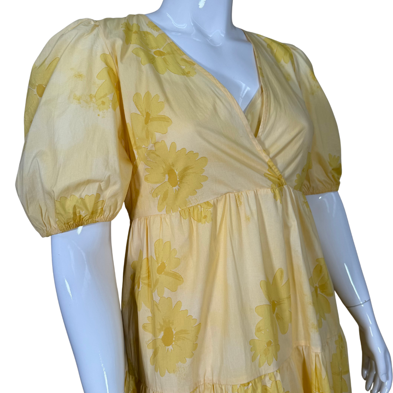 Load image into Gallery viewer, Yellow floral dress on a mannequin against a white background
