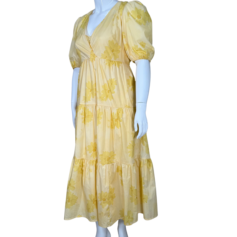 Load image into Gallery viewer, Yellow floral dress on a mannequin against a white background
