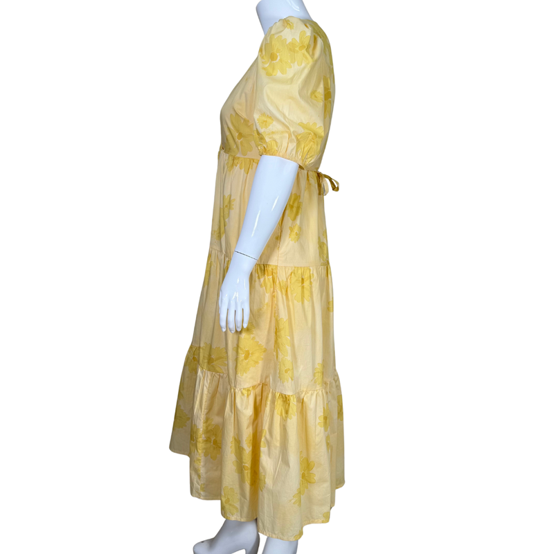 Load image into Gallery viewer, Yellow floral dress on a mannequin against a white background
