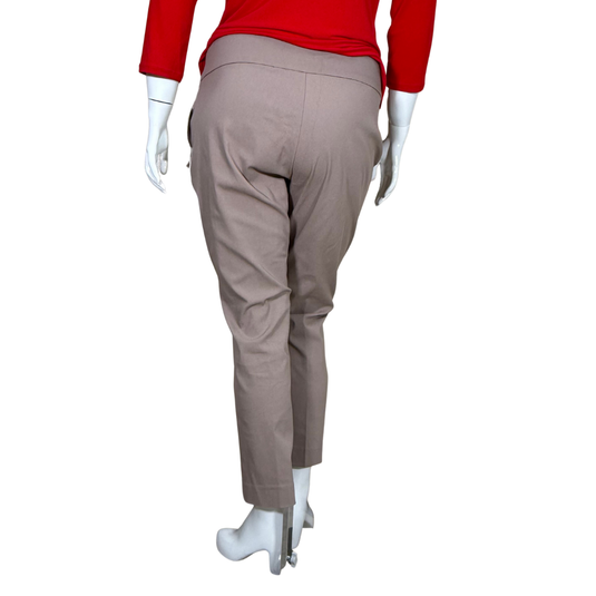 Mannequin wearing beige pants and a red top on a white background