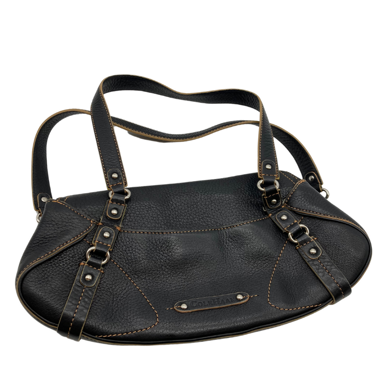 Load image into Gallery viewer, pre-loved Cole Haan Brown Leather Cresent Shape Handbags is a sleek black leather bag with a pebbled texture, accented by contrast stitching and silver-tone hardware. It features double straps for convenient shoulder or hand carry.
