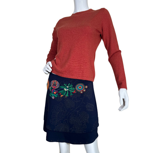 pre-loved Desigual Navy Blue Skirt with Floral Embroidery stylish navy blue skirt features a unique layered design with intricate floral embroidery in vibrant colors, adding a touch of bohemian charm