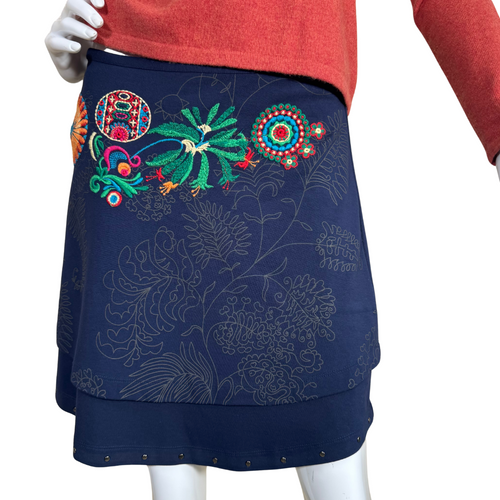 pre-loved Desigual Navy Blue Skirt with Floral Embroidery stylish navy blue skirt features a unique layered design with intricate floral embroidery in vibrant colors, adding a touch of bohemian charm