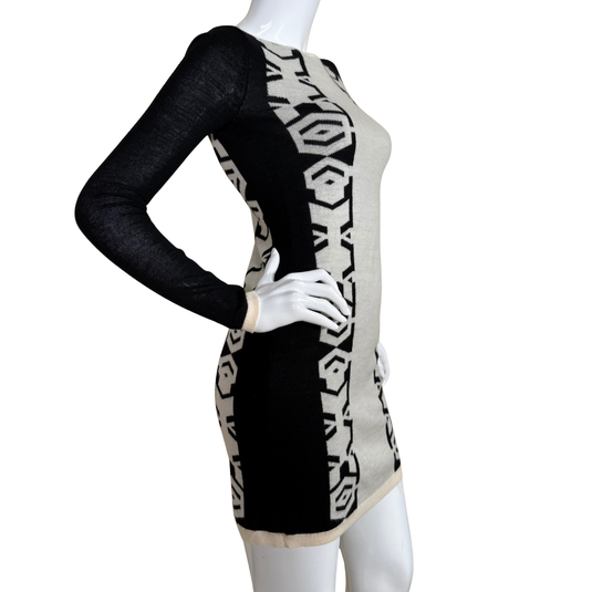 Mannequin wearing a black and white patterned dress on a white background