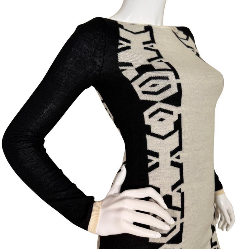 Load image into Gallery viewer, Mannequin wearing a black and beige patterned dress with long sleeves.
