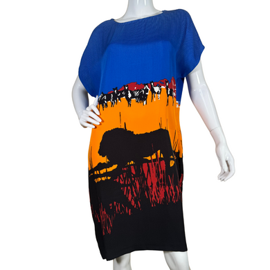 pre-loved Diane Von Furstenberg Unique Blue Dress with Safari Themed Design features a striking African safari-inspired print, showcasing a stunning sunset gradient transitioning from deep blue to fiery orange and red