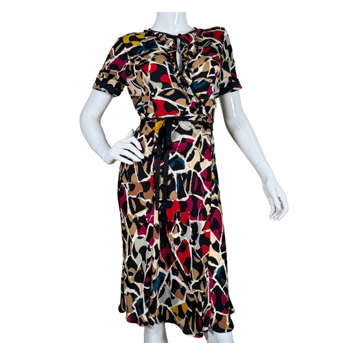 pre-loved eye-catching Diane von Furstenberg Silk Wrap Dress adorned with a playful abstract print in hues of red, mustard, cream, black, and blue
