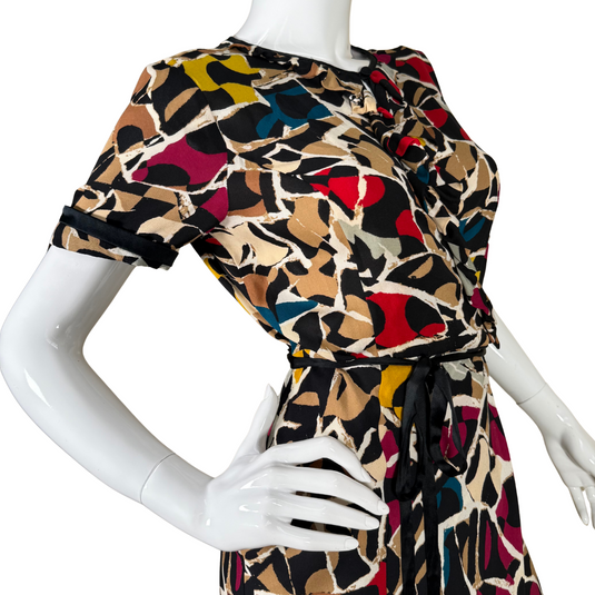 pre-loved eye-catching Diane von Furstenberg Silk Wrap Dress adorned with a playful abstract print in hues of red, mustard, cream, black, and blue