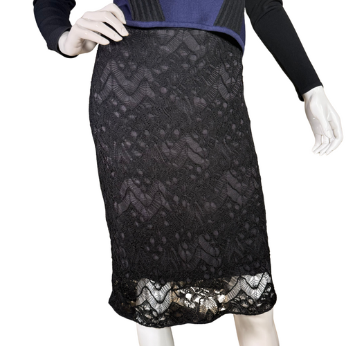 Elegant and timeless, this donated Eileen Fisher Black Skirt with Knit Lace Overlay features an all-over floral lace overlay with intricate patterns that add texture and dimension.