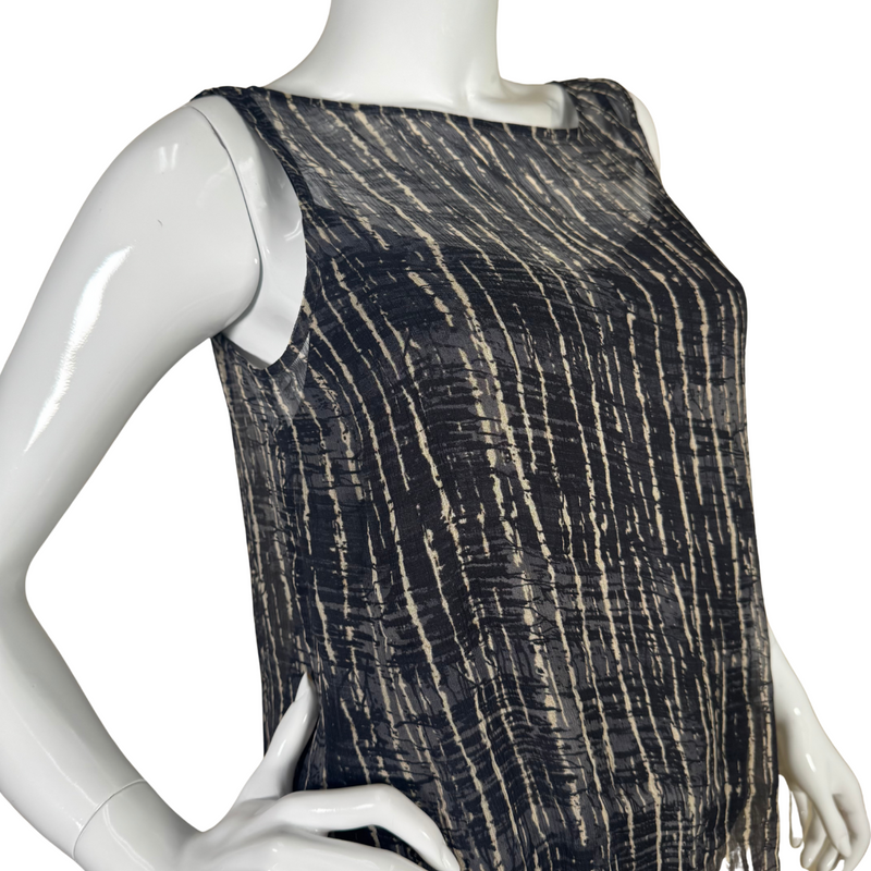 Load image into Gallery viewer, Eileen Fisher Zebra Sheer Sleeveless Blouse is a stylish sleeveless top features a lightweight, semi-sheer fabric with a navy blue and white abstract stripe pattern - side view close up
