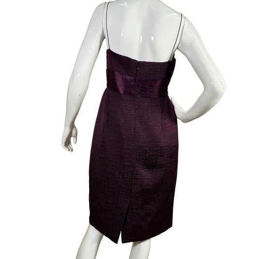 Mannequin wearing a purple dress on a white background