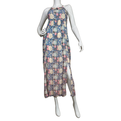 breezy Free People Blue Floral Maxi Dress features a dark blue base adorned with a vintage-inspired floral pattern in shades of cream, pink, and light green