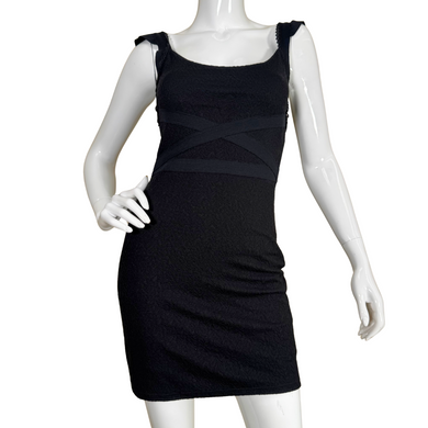 Free People Elegant Black Bodycon Dress is a wardrobe essential, designed to hug your curves in all the right places
