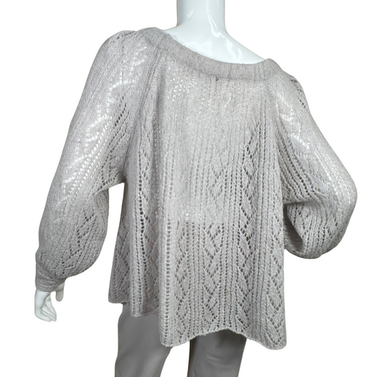 pre-loved Free People Gray Knit Sweater is a stylish and cozy light gray knitted sweater featuring an intricate open-knit pattern throughout