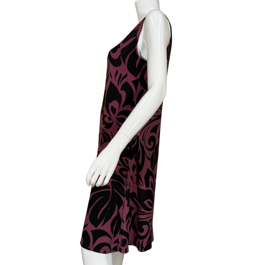 Mannequin wearing a sleeveless dress with a black and purple pattern on a white background