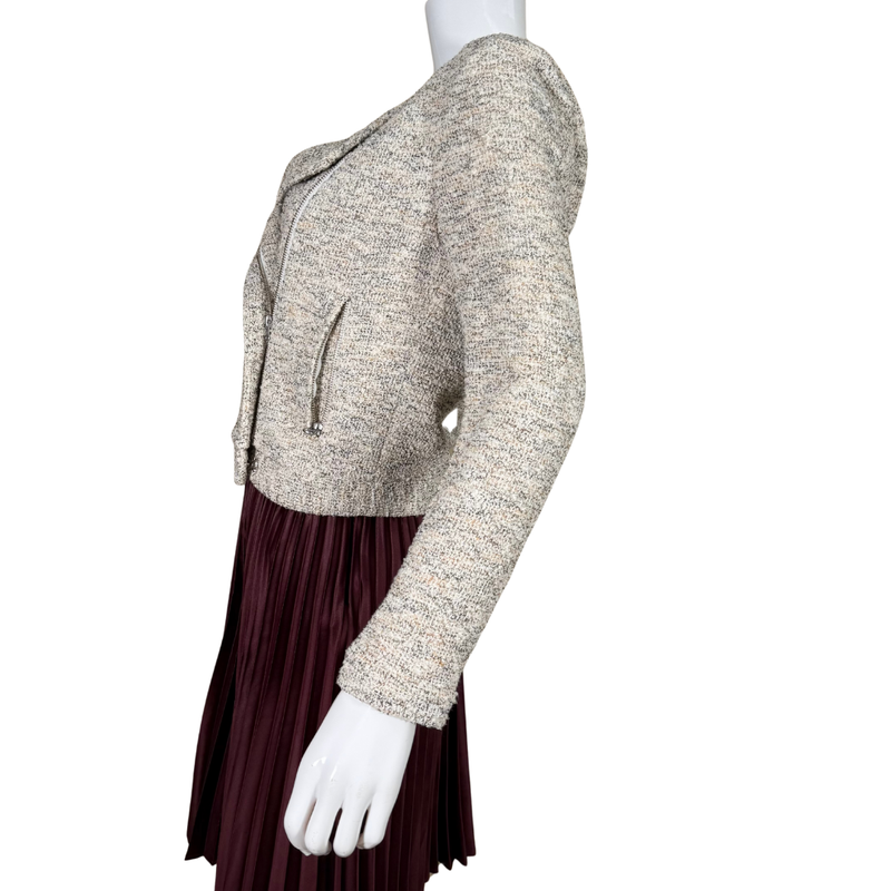 Load image into Gallery viewer, Mannequin wearing a beige textured jacket over a burgundy pleated skirt on a white background
