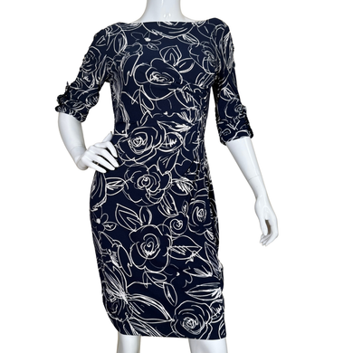 Karl Lagerfeld Navy Floral Print 3/4 Sleeve Dress with white floral line art features a sophisticated 3/4 sleeve design and a figure-skimming silhouette for a polished, feminine look