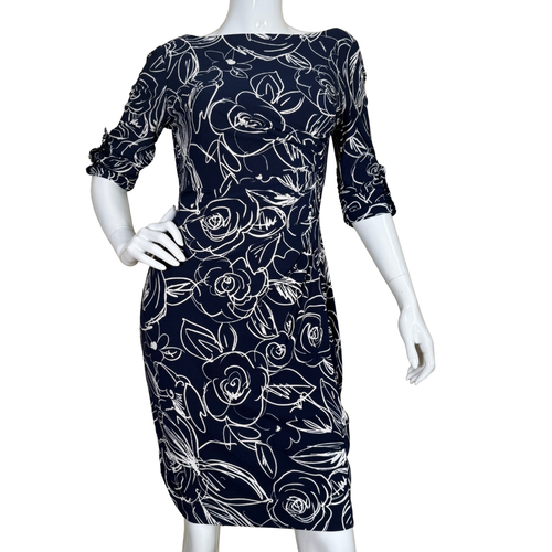 Karl Lagerfeld Navy Floral Print 3/4 Sleeve Dress with white floral line art features a sophisticated 3/4 sleeve design and a figure-skimming silhouette for a polished, feminine look