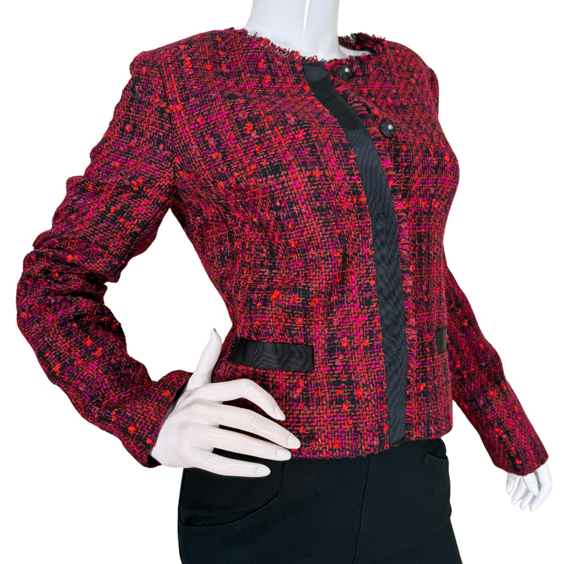 Load image into Gallery viewer, Red and black patterned jacket on a mannequin with a white background
